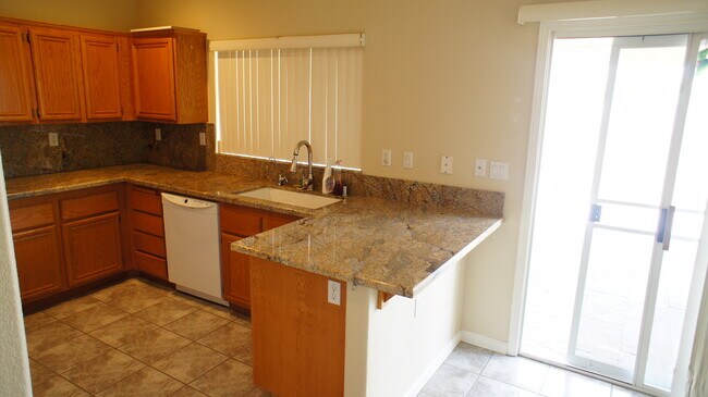 Building Photo - SINGLE STORY HOME 3 BEDROOMS / 2 FULL BATH...
