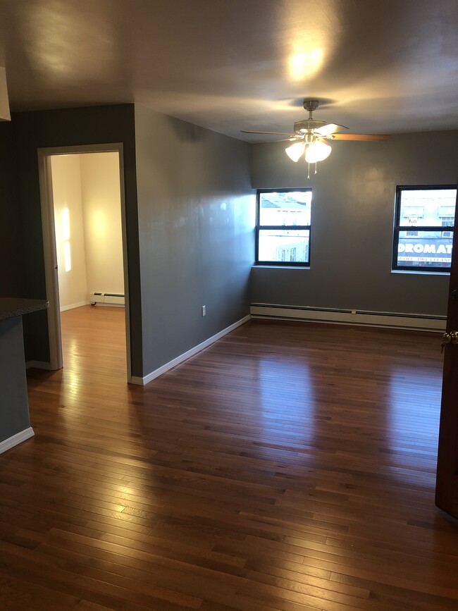 Living room area with 1 main coat closet and 1 pantry closet - 2593 Pitkin Ave