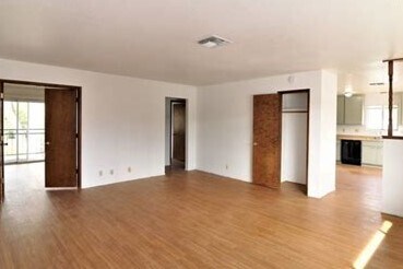Living room with bedroom on left, hallway and bedroom in middle, and closet; kitchen is to the right - 2965 East Way