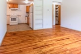 This 620 square foot apartment, located at 1500–1504 Trailsway St in Madison, WI, offers a practical living space with a thoughtful layout. The single-story unit boasts three bedrooms, including a spacious primary bedroom of 170 square feet, a living room, and a kitchen. Throughout the apartment, warm hardwood floors create a cohesive and inviting atmosphere. Large windows in several rooms provide abundant natural light and views of the surrounding area. Built-in storage solutions, including closets with hanging rods, maximize the use of space. The kitchen features wood cabinets, a microwave, and a full-sized range, with durable tile flooring. Baseboard heating ensures comfort during Wisconsin winters. The brick exterior of the building adds a classic touch to the property. While compact, this apartment efficiently utilizes its 620 square feet to provide a comfortable living environment with multiple bedrooms and common areas.