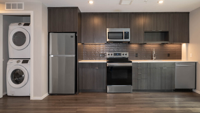 Kitchen with Stainless Steel Appliances and In-home Washer and Dryer - Milo