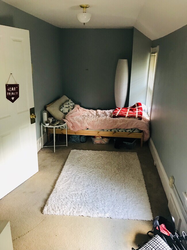 This bedroom features a full walk-in closet. - 3010 Tyler St NE