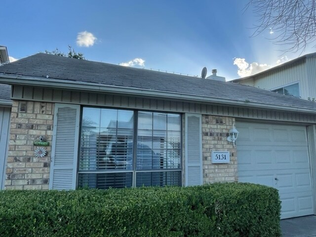 One car garage and driveway - 5131 Burlingame Dr
