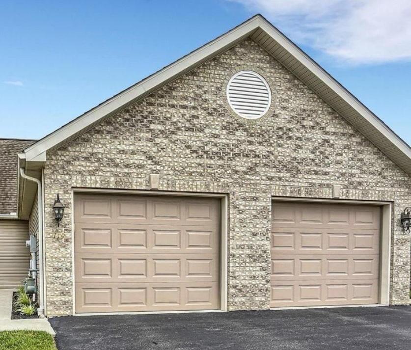 Access to full-size garage (right side if facing the townhouse). Space for a second car in drive. - 121 Touchstone Dr