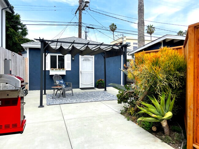 Shaded patio sitting area with brand NEW grill! - 3541 Helms Ave