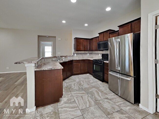 Foto del edificio - 12810 E 67th Pl N