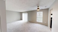 This single-story residence at 33 Hidden Valley Dr, Highland Heights, KY, offers a well-designed living space of 740 square feet. The home features two bedrooms, including a primary bedroom of 150 square feet, and two full bathrooms. The layout includes two hallways for easy navigation throughout the space.

The kitchen is a standout feature, boasting a galley-style design with white cabinetry, granite countertops, and modern black appliances. The wood-look vinyl flooring in the kitchen adds warmth and durability to the space.

Both bedrooms are carpeted and painted in neutral tones, with large windows providing natural light. The bathrooms are fitted with white fixtures, including a tub-shower combination in at least one, and feature wood-look vinyl flooring that complements the kitchen.

Throughout the home, the neutral color palette and textured ceilings create a cohesive, contemporary feel. The property benefits from ample storage, with closets in the bedrooms and hallways. Central air conditioning ensures year-round comfort in this compact yet functional living space.