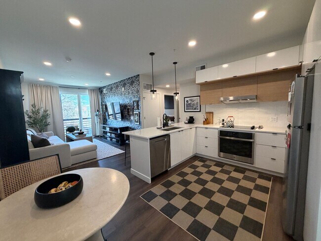 Building Photo - Top-Floor Corner Condo with Downtown Views — Stylish, Pristine, and Steps From Everything