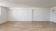Located at 999 NE 167th St in North Miami Beach, FL, this 2-bedroom, 3-bathroom unit offers a bright and clean living environment across a well-organized single-floor layout. Light wood-style flooring flows throughout the space, complementing the crisp white walls and creating a fresh, airy ambiance.

The open combined living and dining area is generously sized, with natural light pouring in through sliding windows that offer outdoor views. A balcony extends the living space further, providing an outdoor retreat. The kitchen features granite countertops, white cabinetry, and includes a refrigerator and dishwasher — delivering a functional and tidy cooking space.

Both bedrooms are comfortably sized, each equipped with a ceiling fan and windows that admit natural light and views of the surrounding area. The primary bedroom offers a notably spacious footprint. An impressive seven closets are distributed throughout the unit, providing exceptional storage capacity.

The three bathrooms are finished in a clean, white palette with tiled shower enclosures accented by mosaic tile borders and granite-topped vanities. A hallway connects the various spaces, contributing to a logical and efficient floor plan. Overall, this unit presents a light-filled, well-organized living space ideally situated in North Miami Beach.