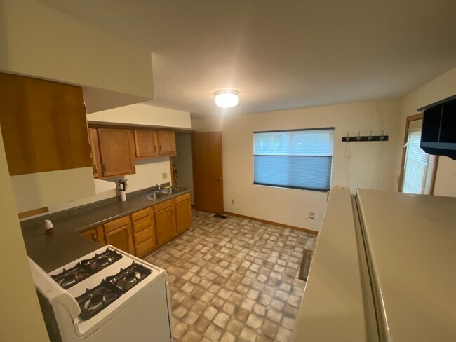Kitchen toward rear - 100 4th Ave NW