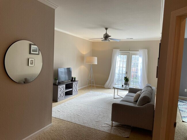 Family Room, Juliet Balcony w/ French Doors - 12820 University Cres