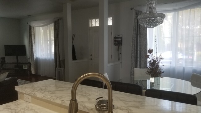 Front door. To the right: Dining room, To the left: Living room - 5824 Acclamation St E
