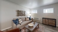 Located at 3900 N Shadeland Ave in Indianapolis, Indiana, this one-bedroom, one-bathroom unit offers a well-organized and efficient single-floor layout. The living room serves as the heart of the space, featuring wood-style flooring, neutral-toned walls, and windows that allow natural light to fill the room. A wall-mounted unit provides climate control, and the open layout comfortably accommodates a seating area and additional furnishings.

The bedroom is a generously sized private retreat with large windows that invite ample natural light and offer exterior views. The wood-style flooring continues throughout, lending a cohesive look to the space. A dedicated closet provides convenient storage directly off the bedroom area.

The bathroom is clean and functional, finished with the same wood-style flooring found throughout the unit. It includes a full tub and shower combination with a curtain rod, a toilet, and a vanity with storage. The bright white fixtures contrast nicely with the soft, neutral tones of the walls.

Overall, the unit presents a practical and comfortable living environment with a consistent design aesthetic — neutral walls, warm wood-look flooring, and natural light — making it an inviting and easy-to-personalize space.