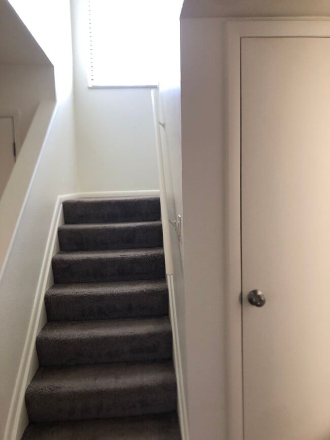 Building Photo - Two bedroom town home with a two car garag...
