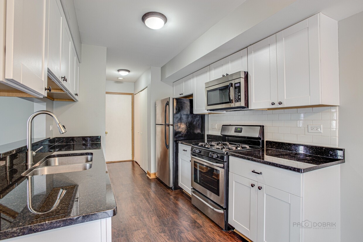 kitchen with granite counters and stainless a - 240 Acorn Dr