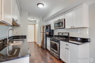 kitchen with granite counters and stainless a - 240 Acorn Dr