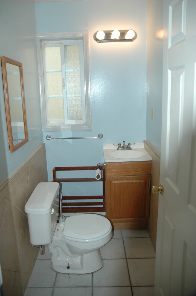 One bathroom downstairs and one up stairs. - 1711 Speyer Ln