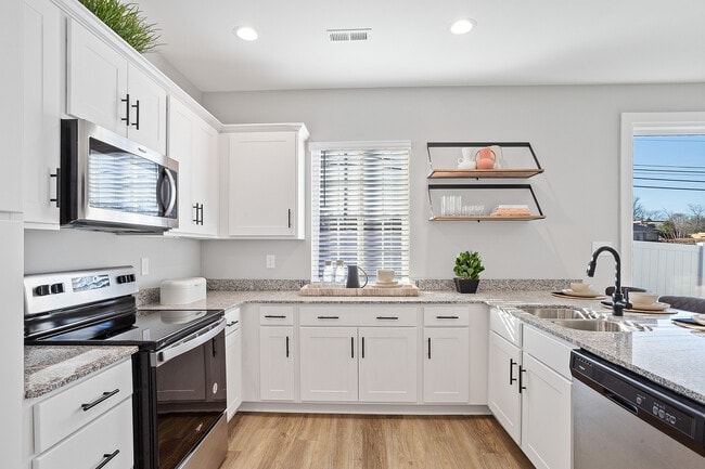 White Cabinetry Kitchens with Ample Natural Lighting - Sanctuary at Indian Creek | Homes for Rent