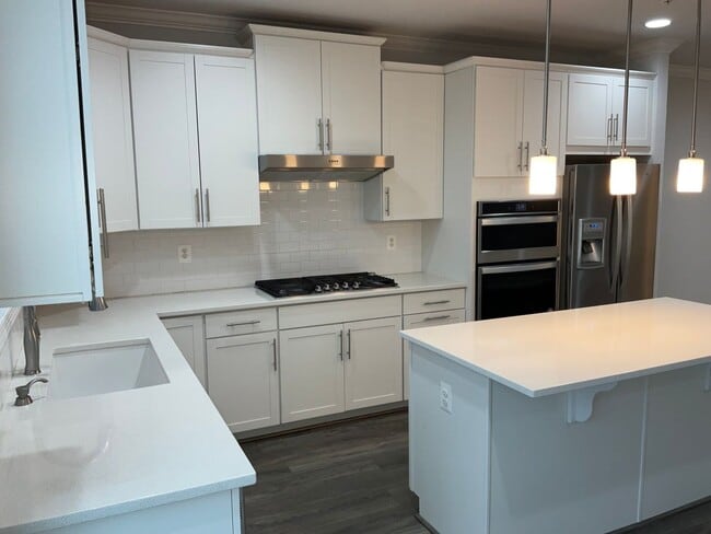 Building Photo - Beautiful 4BR 3.5BA 3 level townhome with 2 car attached garage located in the Cabin Branch Commu...