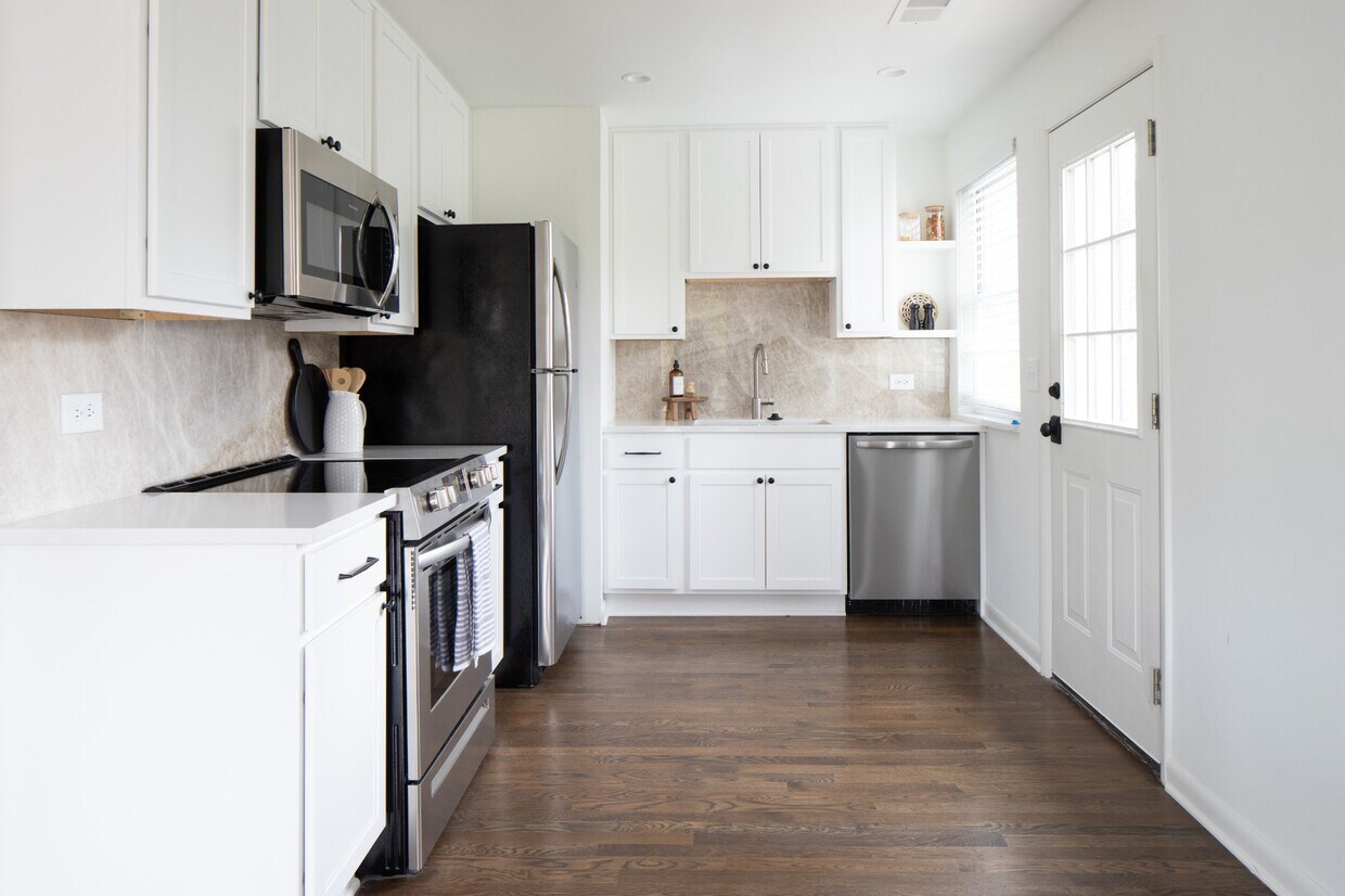 Beautiful quartz counter tops and marble backsplash. - 203 Leake Ave