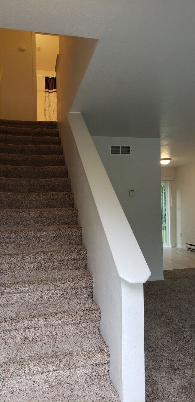 Stairs to full bath and two bedrooms - 301 N Spruce Dr