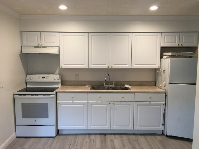 Kitchen with new lighting and flooring - 514 SW 11th CT