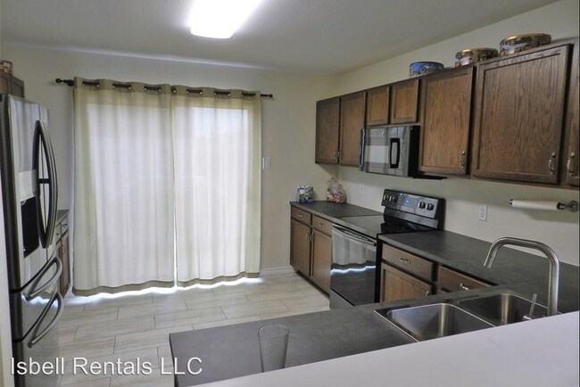 Building Photo - 4 br, 3 bath House - 5713 Capricorn Loop