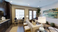 This 1-bedroom, 1-bathroom single-floor residence delivers a smartly designed layout that maximizes comfort and functionality. The living area serves as the heart of the home, featuring rich hardwood-style flooring that runs throughout and anchors the space with warmth. Neutral-toned walls provide a versatile backdrop, complemented by recessed lighting that brightens the interior evenly. Two generously sized windows dressed with classic white blinds allow natural light to fill the room while offering privacy, framing views of the surrounding exterior. The living space comfortably accommodates a full seating arrangement, making it ideal for both relaxing and entertaining. Thoughtful design details, such as dark-trimmed window surrounds, add a refined contrast to the light walls. A touch of greenery from an indoor plant introduces a natural, lively element to the corner of the room. The overall ambiance is warm and sophisticated, with a curated blend of classic and contemporary styling evident in the architectural details. This residence offers an efficient yet comfortable footprint well-suited for a variety of lifestyles.
