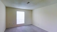 Located at 104 Sandburg Place in Newark, Delaware, this single-floor home offers a clean and functional layout with a calm, neutral aesthetic throughout. The interior is finished with soft, wall-to-wall carpeting that adds warmth and comfort underfoot, complemented by smooth, beige-toned walls that create a bright and welcoming atmosphere. The textured ceilings add a classic touch, while centrally placed HVAC vents ensure consistent climate control throughout the space. Natural light plays a key role in the ambiance of the home, with windows fitted with horizontal blinds allowing residents to adjust brightness and privacy with ease. The windows draw in ample daylight, making the rooms feel open and airy even in their unfurnished state. Electrical outlets are thoughtfully positioned along the baseboards, providing practical accessibility throughout. The overall design is understated and versatile, offering a neutral canvas well-suited to a variety of furnishing styles and personal tastes. The single-level layout enhances accessibility and ease of movement, making this home a practical and comfortable option in the Newark, Delaware area.
