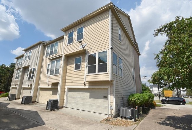 Rear view of 2 car garage,2 visitor spots too - 1706 Dennis St