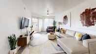 Located at 1333 N 24th St in Phoenix, AZ, this well-appointed one-bedroom, one-bathroom unit offers a thoughtfully designed single-floor layout. The open-concept living room and kitchen area serves as the heart of the home, featuring wood-look flooring, bright white walls, and a sliding glass door that fills the space with natural light and provides access to an outdoor area. The living room offers generous room for seating and entertainment, with ceiling fan lighting overhead. The kitchen is equipped with light maple cabinetry, a full suite of white appliances including a refrigerator, electric range, and built-in microwave, complemented by a breakfast bar with seating for two — ideal for casual dining. The bedroom is a comfortable retreat featuring wood-look flooring, a window for natural light, and direct access to a dedicated closet. The full bathroom includes a soaking tub and shower combination with classic white tile and black accent detailing. A dedicated laundry room houses the in-unit washer and dryer alongside the water heater, adding practical convenience. Throughout the unit, clean lines and a neutral palette create a bright, inviting atmosphere suited for comfortable everyday living in Phoenix.