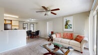 Located at 3440 N Goldenrod Rd in Winter Park, Florida, this single-story, two-bedroom, two-bathroom residence offers a well-organized and functional layout. The open-concept living and dining area forms the heart of the home, featuring plush carpet, a ceiling fan with light fixture, and a large sliding glass door that invites natural light and outdoor views. The adjacent kitchen is equipped with wood-tone cabinetry, a breakfast bar peninsula, hard surface countertops, and black appliances, with light wood-style flooring that carries through the dining space.

Both bedrooms are carpeted and comfortably sized, with the primary bedroom offering a window for natural light and access to a dedicated closet. Each bathroom includes a single-sink vanity with wood-tone cabinetry, a tub/shower combination, and wood-style flooring. A dedicated in-unit laundry room accommodates a full-size washer and dryer with additional overhead shelving for storage. A connecting hallway and two closets provide practical organization throughout. Textured ceilings are consistent across the home. This residence delivers a straightforward, livable floor plan well-suited for those seeking comfort and convenience in the Winter Park area.