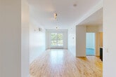 Located at 4350 Avenue De L'hôtel-De-Ville in Montréal's vibrant Plateau-Mont-Royal neighbourhood, this well-appointed one-bedroom, one-bathroom unit offers a clean, minimalist design across a single floor. The bright living room features light-toned hardwood flooring, a large window framing a lush treetop view, and a wall-mounted air conditioning unit for year-round comfort. The modern kitchen is efficiently designed with sleek grey cabinetry extending to the ceiling, white countertops, a stainless steel sink with a pull-down faucet, and a full suite of appliances including a cooktop, dishwasher, and refrigerator. The bedroom is finished with smooth, light blue polished flooring, crisp white walls, and a window offering views of the surrounding Montréal streetscape. A dedicated laundry area adds practical convenience. The bathroom is tastefully appointed with beige tile flooring and surround, a soaker tub with a glass panel enclosure, and a clean, functional layout. Throughout the unit, white walls and consistent finishes create a cohesive, light-filled ambiance that is both practical and welcoming.