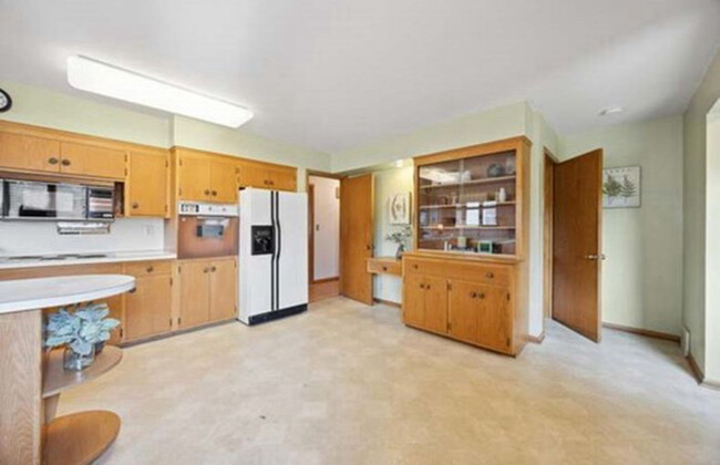 Large spacious kitchen. New appliances, new countertops and new flooring going in December 2024. - 5709 Goodrich Ave