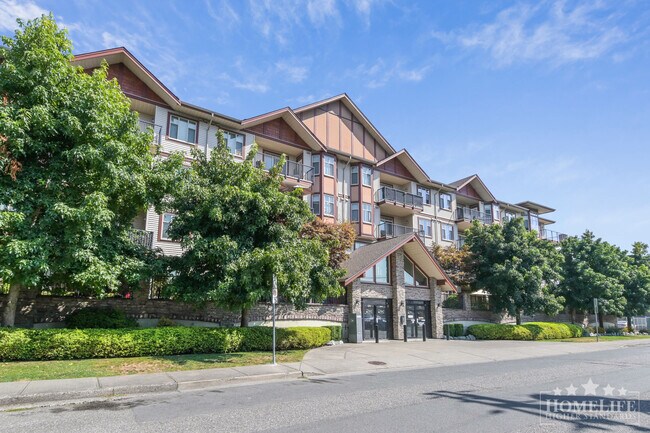 Building Photo - High-End Top-Floor 1 Bed + Den Condo with New Flooring & Paint in Central Chilliwack