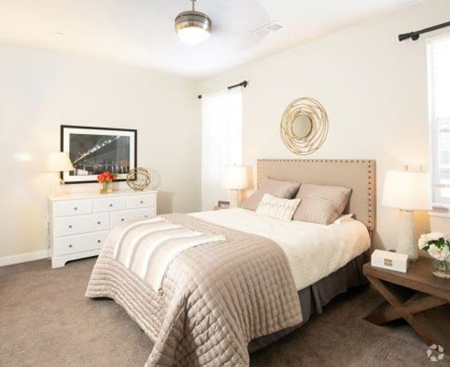Comfortable Bedroom - Parc on Center Apartments & Townhomes