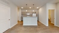 This single-story residence at 1100 Sugarbush Dr, Ashland, OH, offers a contemporary living space with a thoughtful layout. The home features an open floor plan, seamlessly connecting the kitchen, dining, and living areas. The kitchen is equipped with white appliances, including a refrigerator, stove, and microwave, complemented by light-colored cabinetry and granite countertops. A combination of flooring types is used throughout, with wood-look laminate in main living areas and plush carpeting in bedrooms.

The bedrooms are generously sized, featuring ceiling fans and large windows that allow natural light to flood the space. A walk-in closet provides ample storage. The bathroom boasts a double vanity with a large mirror, modern lighting fixtures, and a clean, neutral color scheme.

The living room is spacious, with a ceiling fan and multiple windows offering views of the outdoors. Throughout the home, recessed lighting and modern fixtures provide bright, even illumination. The overall design aesthetic is clean and neutral, creating a blank canvas for personalization while maintaining a contemporary feel.