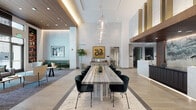 The lobby at 427 S Hill St in downtown Los Angeles presents a refined, contemporary design that makes a strong first impression. Soaring double-height ceilings define the central volume, amplifying the sense of openness and grandeur. Large floor-to-ceiling glass entry doors welcome natural light from S Hill Street, framed by warm wood-paneled ceilings and a decorative chandelier overhead.

The main floor is anchored by a striking stone communal table surrounded by sleek black upholstered chairs, positioned beneath cascading glass pendant lighting. Polished large-format tile flooring with marble inlay details runs throughout, lending a clean and luxurious aesthetic. The concierge desk is a standout feature, clad in marble with rich dark wood paneling and a dramatic ink-wash landscape mural as its backdrop.

A separate lounge area offers a more relaxed atmosphere, furnished with sofas, accent chairs, and built-in shelving with warm-lit displays, providing street views through expansive windows. Curated artwork appears throughout the lobby, including a bold gold-framed serpent piece and a vibrant emerald painting above a stone pedestal table. Lush indoor plants add organic warmth. Together, these elements create a polished, welcoming environment suited to a premier downtown Los Angeles address.