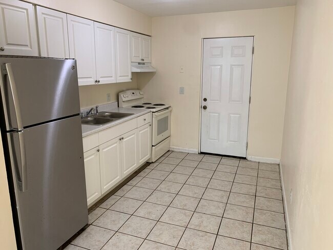 Kitchen and back door - 1415 E 98th Ave