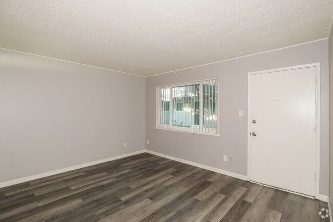 1BR, 12BA - 540SF - Living Room - Sunset Crossing