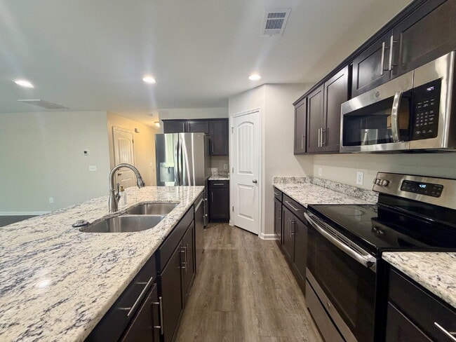 Building Photo - Heritage New Riverside Three Bedroom Home w. Fenced in Yard!