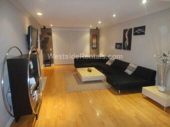 Living room with front facing balcony - 430 N Oakhurst Dr