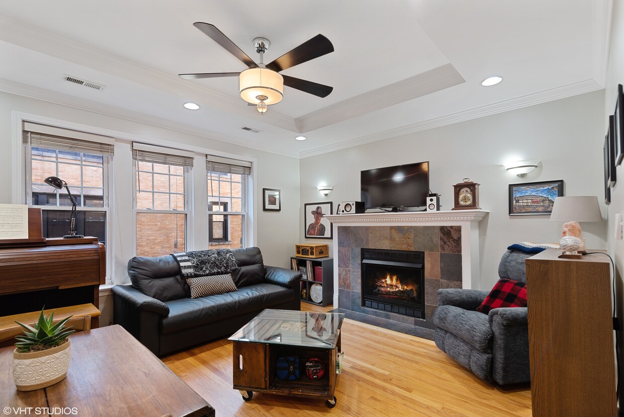 Beautiful living room with tray ceilings. - 6969 N Wolcott Ave