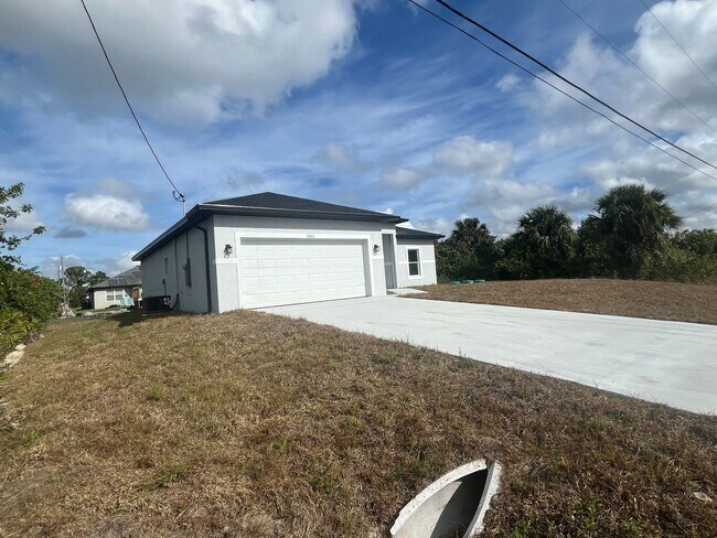 Photo - Brand new 4 bedroom 2 bath-2 car garage-SW LEHIGH ACRES House
