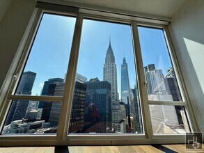 Building Photo - SUNNY NO FEE STUDIO IN THE LUXURY SUMMIT NYC