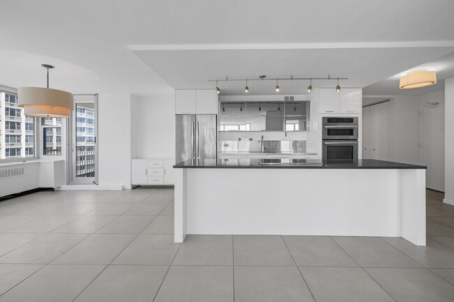 Open kitchen, dining space - 4250 N Marine Dr