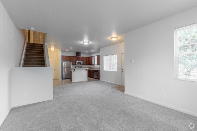 3BR, 2.5BA - 1566SF - Living Room - The Landing Apartments and Townhomes