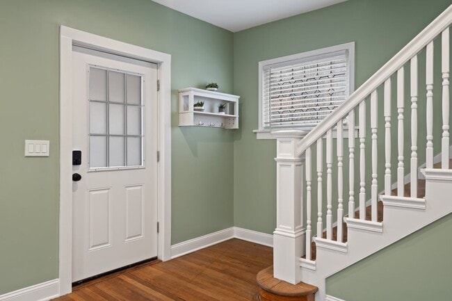 Welcome home! Front door with digital lock, entryway foyer and staircase - 4517 Tracy Ave