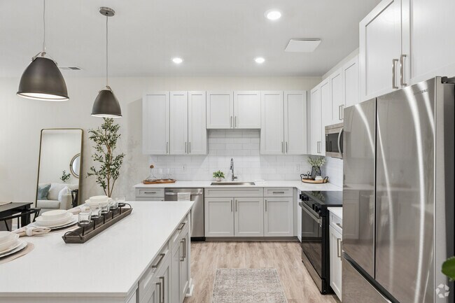 B1 - 2 habitaciones, 2 baños - 1174 pies cuadrados - Cocina - Arbor View Townhomes