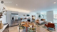 Imagine waking up each day in a space that inspires and delights. This exquisite property at 723 Rigsbee Ave, Durham, NC, is more than just a home—it's a canvas for your dreams. The moment you step inside, you're greeted by an ambiance of modern elegance and thoughtful design.

The heart of this urban retreat is the gourmet kitchen, where sleek white cabinetry meets state-of-the-art stainless steel appliances. The open concept seamlessly blends the kitchen with a chic dining area, perfect for entertaining friends or enjoying intimate family meals. Large windows flood the space with natural light, creating an airy and inviting atmosphere.

The primary bedroom is a true sanctuary, boasting an impressive 320 square feet of luxurious space. Floor-to-ceiling windows offer breathtaking city views, while stylish furnishings and warm wood accents create a cozy retreat. With four impeccably designed bathrooms, this home ensures comfort and convenience for both residents and guests.

Throughout the property, you'll find touches of contemporary charm, from the mid-century inspired dresser in the closet area to the artful lighting fixtures. The clever use of mirrors and metallic accents adds depth and sophistication to every room. Warm wood flooring unifies the space, while pops of color in the bathrooms add character and flair.

This isn't just a place to live—it's a lifestyle upgrade. Located in the vibrant heart of Durham, you're steps away from culture, cuisine, and community. Whether you're a young professional, a small family, or someone who appreciates the finer things in life, this property offers the perfect blend of urban convenience and home comfort. Don't just dream about your ideal lifestyle—make it a reality in this stunning urban oasis.